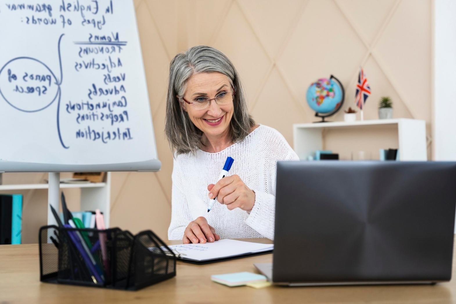 Person reviewing financial documents and planning monthly budget
